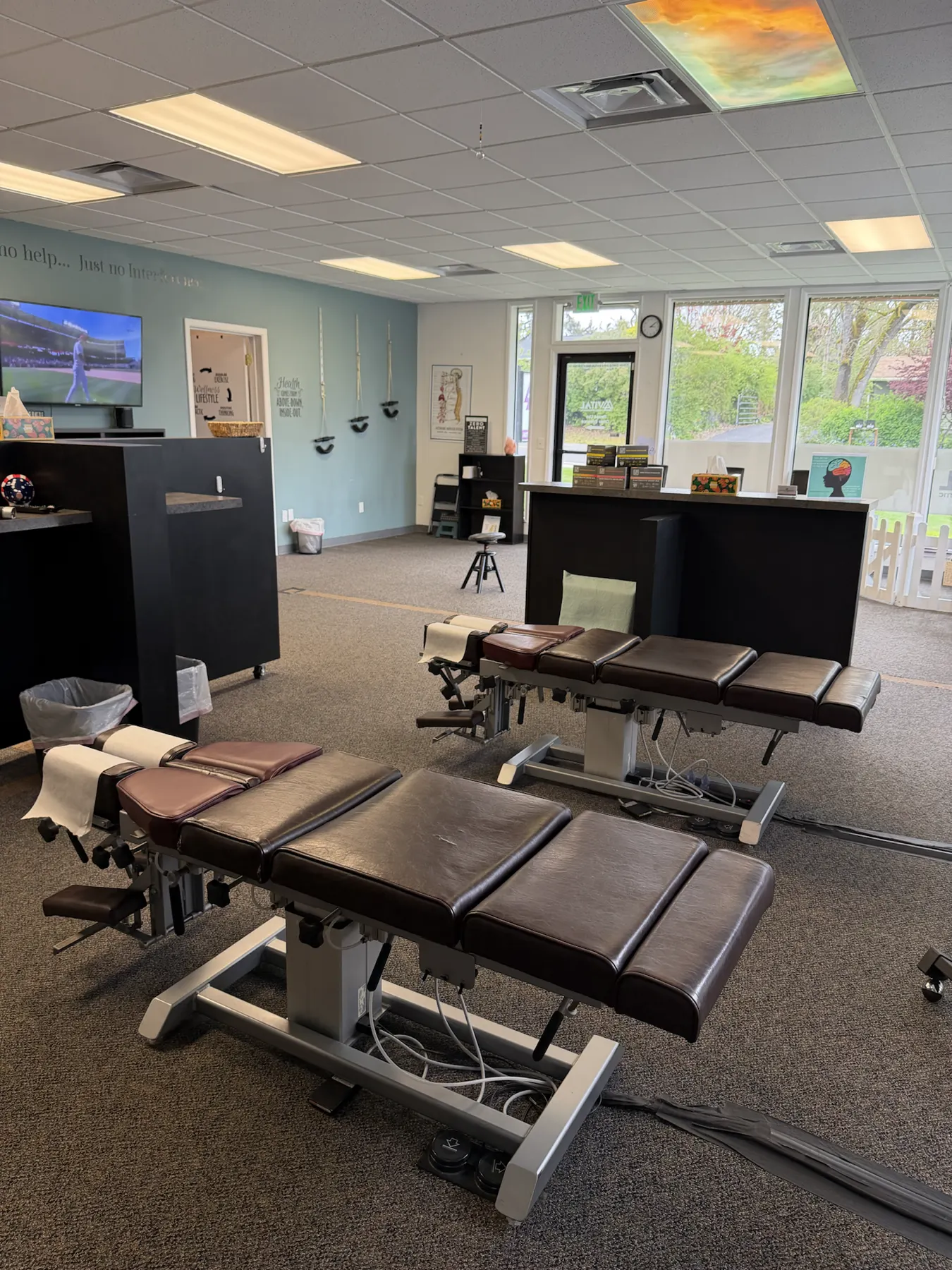 Treatment bay with adjustment tables at True Health Chiropractic